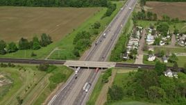 4.8K aerial stock footage of an interstate cutting through farmland, Ravenna, Ohio Aerial Stock Footage | AX107_084E