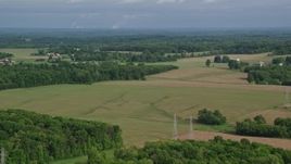 4.8K aerial stock footage flying over trees and farmland, Columbiana, Ohio Aerial Stock Footage | AX107_103E