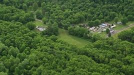 4.8K aerial stock footage flying away from forests, reveal rural homes, Darlington, Pennsylvania Aerial Stock Footage | AX107_120E