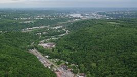 4.8K aerial stock footage of forests and industrial buildings, Beaver Falls, Pennsylvania Aerial Stock Footage | AX107_130