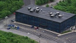 4.8K aerial stock footage of an office building with nearly empty parking lot in Pittsburgh, Pennsylvania Aerial Stock Footage | AX107_206E