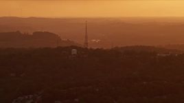 4K aerial stock footage flying by a radio tower, Penn Hills, Pennsylvania, sunset Aerial Stock Footage | AX108_002