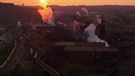 4K aerial stock footage of the U.S. Steel Mon Valley Works, Braddock, Pennsylvania, sunset Aerial Stock Footage | AX108_015E