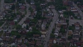 4K aerial stock footage of urban neighborhoods, Pittsburgh, Pennsylvania, twilight Aerial Stock Footage | AX108_044E