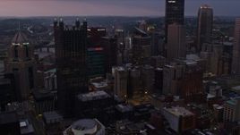 4K aerial stock footage of a view of the city's skyscrapers in Downtown Pittsburgh, twilight Aerial Stock Footage | AX108_066E