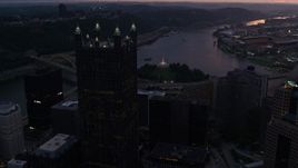 4K aerial stock footage approaching PPG Place revealing Point State Park, Downtown Pittsburgh, Pennsylvania, twilight Aerial Stock Footage | AX108_084E