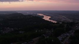 4K aerial stock footage of hilltop neighborhoods, Pittsburgh, Pennsylvania, twilight Aerial Stock Footage | AX108_106E