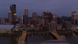 4K aerial stock footage a view of tall Downtown Pittsburgh skyscrapers, Pennsylvania, twilight Aerial Stock Footage | AX108_116E