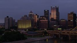 4K aerial stock footage of Downtown Pittsburgh skyscrapers from Fort Pitt Bridge, Pennsylvania, twilight Aerial Stock Footage | AX108_124