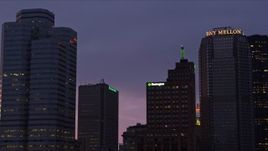 4K aerial stock footage looking up to the top of the Grant Building, Downtown Pittsburgh, twilight Aerial Stock Footage | AX108_131