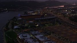 4K aerial stock footage approaching Heinz Field, Pittsburgh, Pennsylvania, twilight Aerial Stock Footage | AX108_144E