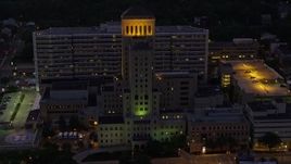 4K aerial stock footage orbiting Allegheny General Hospital, Pittsburgh, Pennsylvania, night Aerial Stock Footage | AX108_149