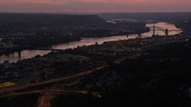 4K aerial stock footage approaching Western State Penitentiary along the river, Pittsburgh, Pennsylvania, twilight Aerial Stock Footage | AX108_154