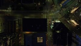 4K aerial stock footage of a bird's eye of Forbes Avenue and buildings Downtown Pittsburgh, Pennsylvania, night Aerial Stock Footage | AX108_180E