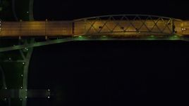 4K aerial stock footage of a bird's eye orbiting Fort Duquesne Bridge, Downtown Pittsburgh, night Aerial Stock Footage | AX108_185