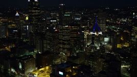 4K aerial stock footage flying by skyscrapers, Downtown Pittsburgh, Pennsylvania, night Aerial Stock Footage | AX108_213