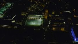 4K aerial stock footage flying over Carnegie Mellon University campus buildings, Pittsburgh, night Aerial Stock Footage | AX108_247