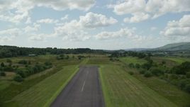 5.5K aerial stock footage of liftoff from Cumbernauld Airport, Scotland Aerial Stock Footage | AX109_001