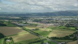 5.5K aerial stock footage video of flying over farms toward rural homes, Stirling, Scotland Aerial Stock Footage | AX109_013