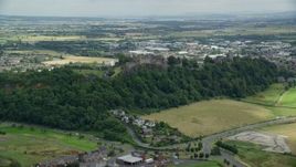 5.5K aerial stock footage approach and tilt to castle grounds of Stirling Castle, Scotland Aerial Stock Footage | AX109_022E