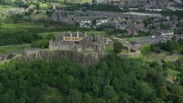 5.5K aerial stock footage orbiting historic Stirling Castle and grounds with tourists, Scotland Aerial Stock Footage | AX109_038E
