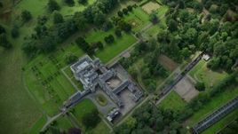 5.5K aerial stock footage of Keir House surrounded by trees, Scotland Aerial Stock Footage | AX109_060