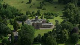 5.5K aerial stock footage orbit Manor Hall Center for Trauma hospital and neighboring homes, Scotland Aerial Stock Footage | AX109_081E