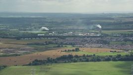 5.5K aerial stock footage of factory with smoke stacks in a small town of Cowie, Scotland Aerial Stock Footage | AX109_107E