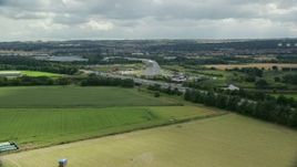 5.5K aerial stock footage of The Kelpies sculptures and M9 highway, Falkirk, Scotland Aerial Stock Footage | AX109_122E