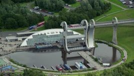 5.5K aerial stock footage of ferries on the Falkirk Wheel boat lift, Scotland Aerial Stock Footage | AX109_144