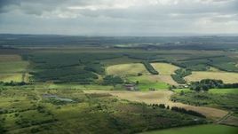 5.5K aerial stock footage of Scottish farm fields and countryside, Bonnybridge, Scotland Aerial Stock Footage | AX109_167E