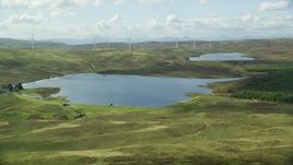 5.5K aerial stock footage fly over Earlsburn Reservoir 2 and approach Gargunnock Hills, Scotland Aerial Stock Footage | AX110_018E