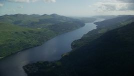 5.5K aerial stock footage of a view of the calm waters of Loch Long, Scottish Highlands, Scotland Aerial Stock Footage | AX110_089