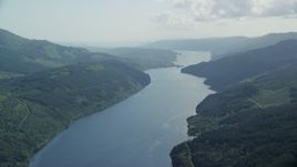 5.5K aerial stock footage of the calm waters of Loch Long, Scottish Highlands, Scotland Aerial Stock Footage | AX110_090