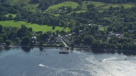 5.5K aerial stock footage orbiting a village on the shores of Loch Lomond, Luss, Scottish Highlands Aerial Stock Footage | AX110_107