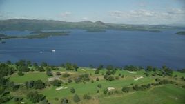 5.5K aerial stock footage of orbiting Loch Lomond Golf Course, Luss, Scottish Highlands, Scotland Aerial Stock Footage | AX110_118