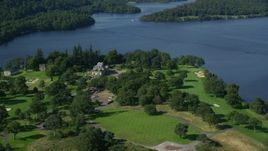 5.5K aerial stock footage of Rossdhu Mansion at Loch Lomond Golf Course, Luss, Scottish Highlands, Scotland Aerial Stock Footage | AX110_119E