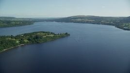5.5K aerial stock footage fly over Loch Lomond, Scottish Highlands, Scotland Aerial Stock Footage | AX110_122E