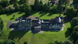 5.5K aerial stock footage of Lomond Castle by Loch Lomond, Arden, Scottish Highlands, Scotland Aerial Stock Footage | AX110_126