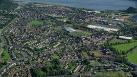 5.5K aerial stock footage approach and tilt to residential neighborhood, Dumbarton, Scotland Aerial Stock Footage | AX110_138E
