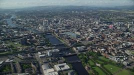 5.5K aerial stock footage of River Clyde with bridges by city buildings, Glasgow, Scotland Aerial Stock Footage | AX110_166E