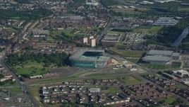 5.5K aerial stock footage approach Celtic Park soccer stadium in Glasgow, Scotland Aerial Stock Footage | AX110_185E