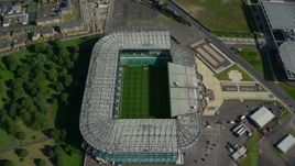 5.5K aerial stock footage tilt to bird's eye of the soccer field in Celtic Park Stadium, Glasgow, Scotland Aerial Stock Footage | AX110_188