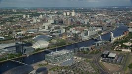5.5K aerial stock footage approach office buildings from River Clyde, Glasgow, Scotland Aerial Stock Footage | AX110_206E