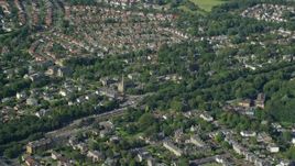 5.5K aerial stock footage of orbiting a church in a suburban neighborhood, Glasgow, Scotland Aerial Stock Footage | AX110_222E