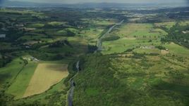 5.5K aerial stock footage of farm fields around a river, Cumbernauld, Scotland Aerial Stock Footage | AX110_229E