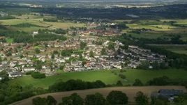 5.5K aerial stock footage of rural homes in a village, Bonnybridge, Scotland Aerial Stock Footage | AX110_234