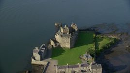 5.5K aerial stock footage of an orbit of the iconic Blackness Castle on the bank of the River Forth, Scotland Aerial Stock Footage | AX111_037E