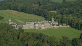 5.5K aerial stock footage of zooming to a wider view while passing Hopetoun House, Scotland Aerial Stock Footage | AX111_046E