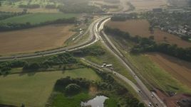 5.5K aerial stock footage of M90 highway Interchange and farmland, South Queensferry, Scotland Aerial Stock Footage | AX111_094E